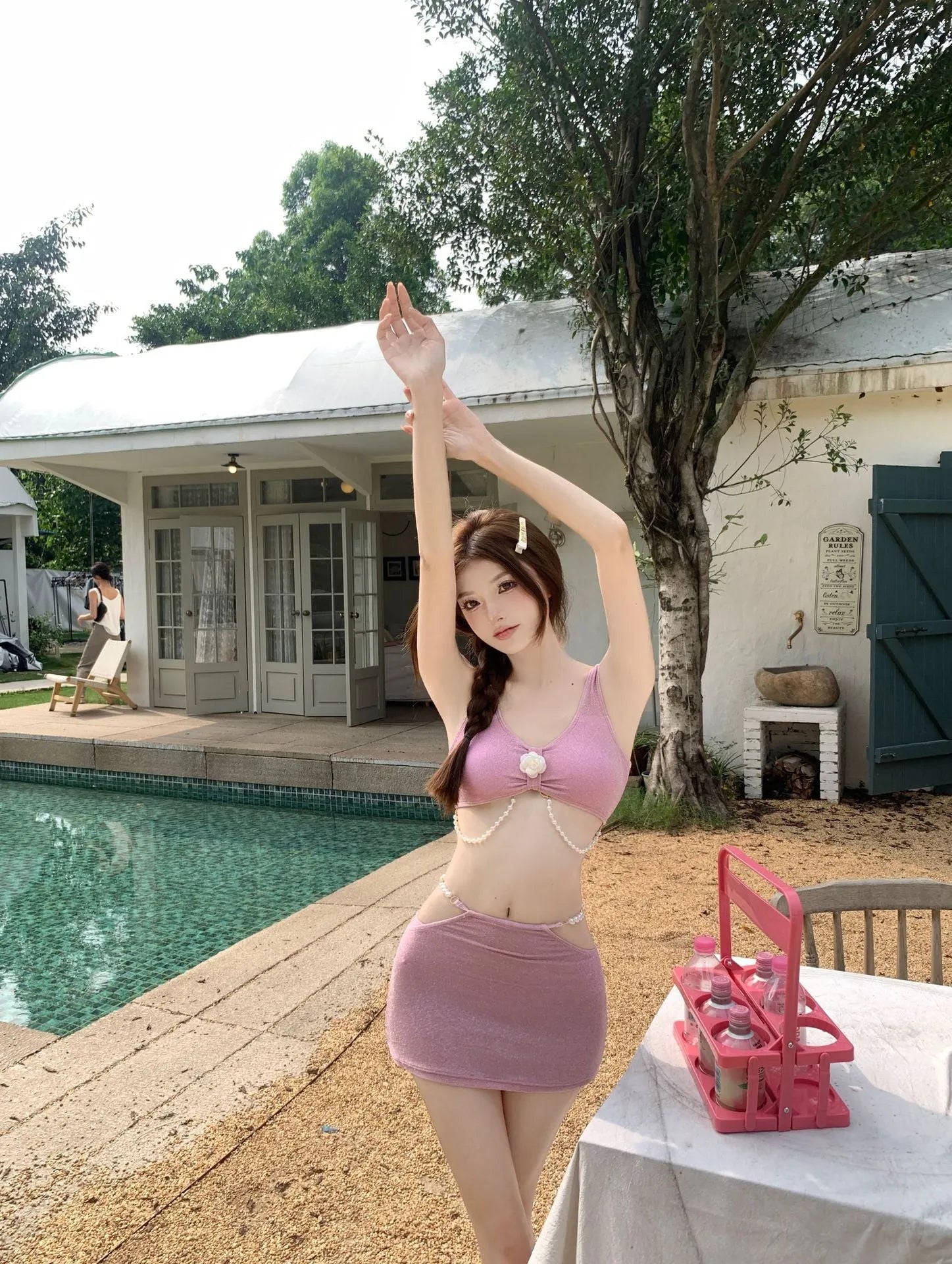 Women's pink and black three-piece polyester bikini for swimming and hot springs.