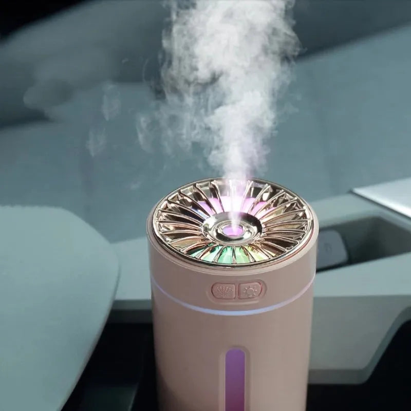 Black USB rechargeable car humidifier with colourful lights showing mist output, sized for cup holders
