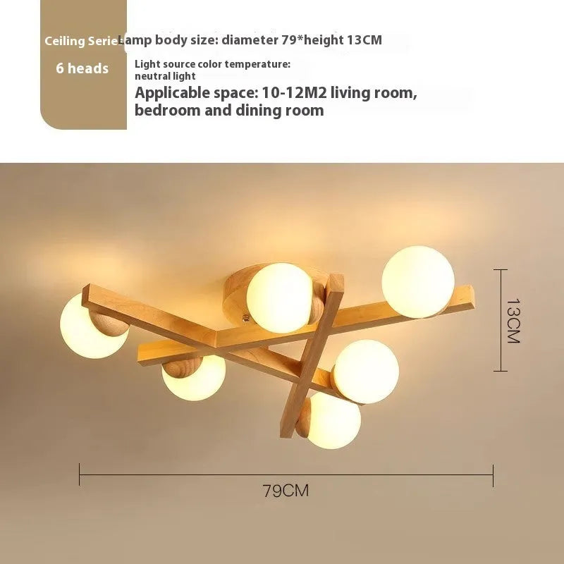 Modern Nordic-style ceiling light with wooden accents and three white lamp heads mounted on a clean, white ceiling.