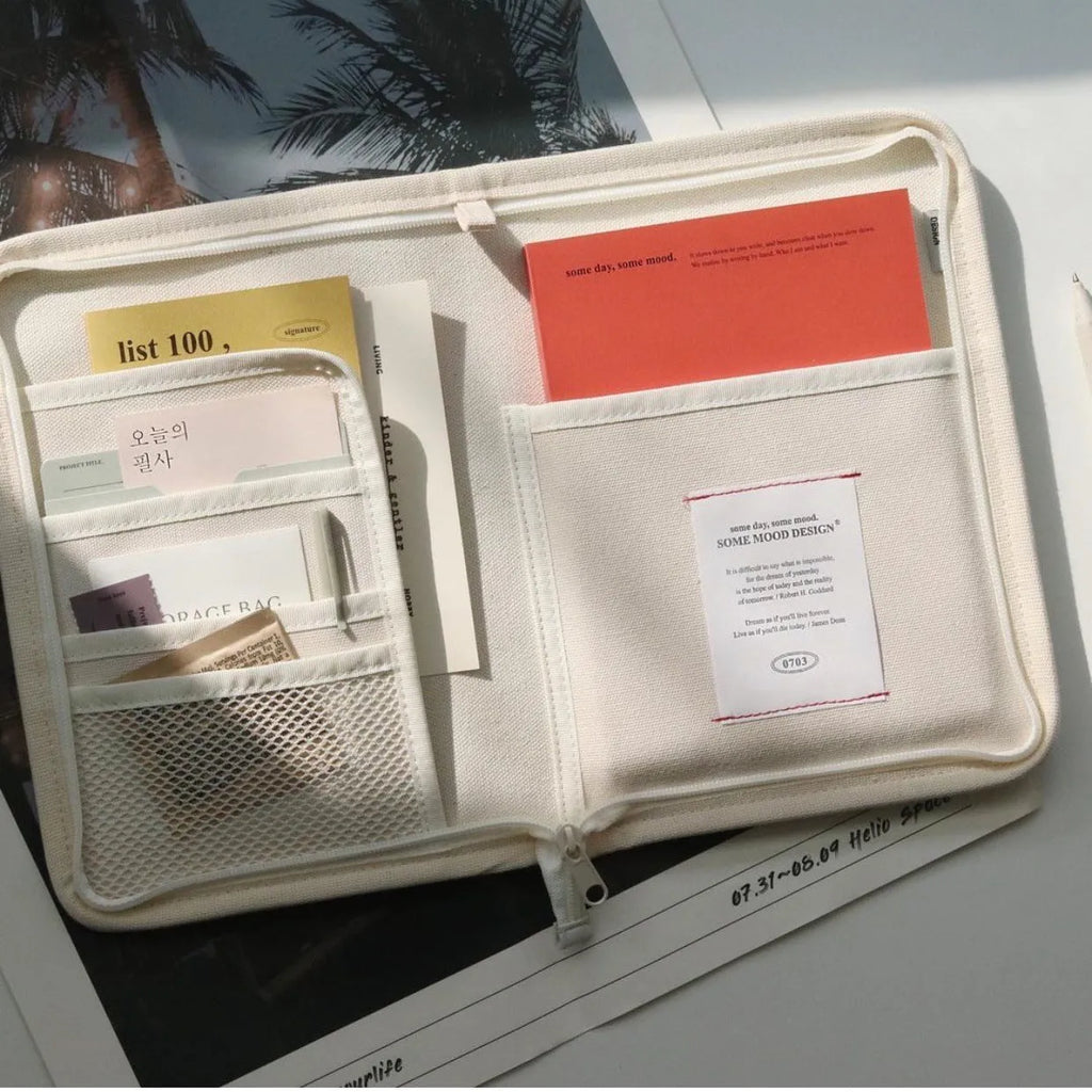 12 inch canvas tablet sleeve bag with zip opening, soft handle, clutch style, in black or white.