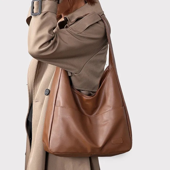 Women's soft square PU shoulder bag in retro style with open pocket and single strap.