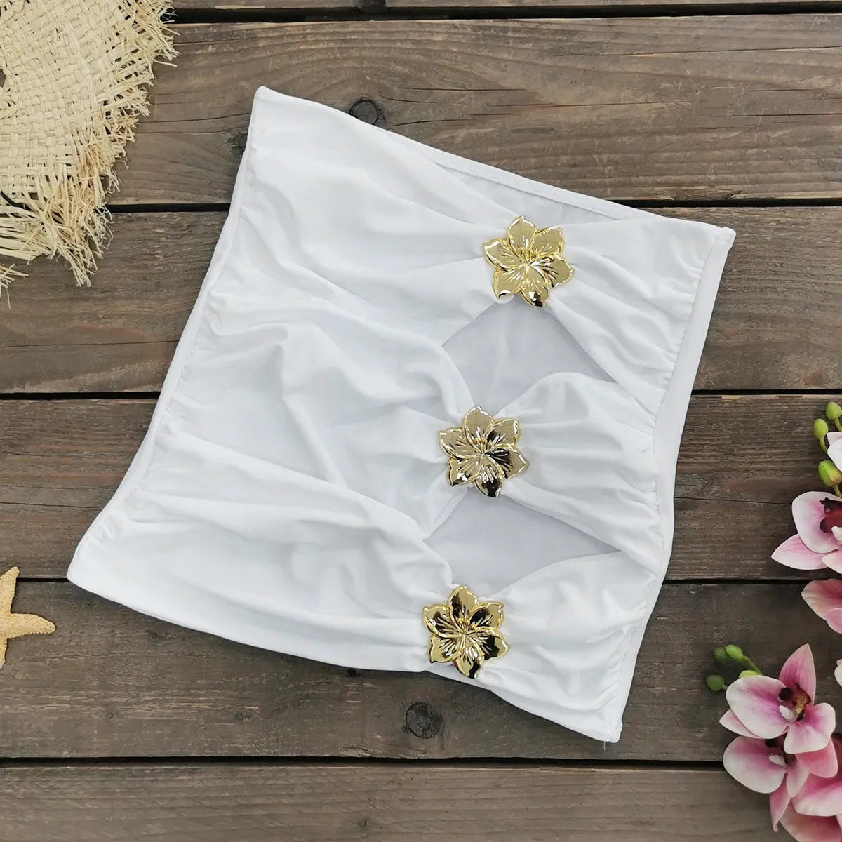 Women's solid colour one-piece swimsuit with high waist and matching short skirt.