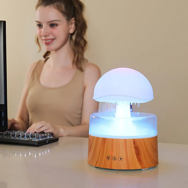 White rain cloud shaped humidifier with LED lighting and aromatherapy functions
