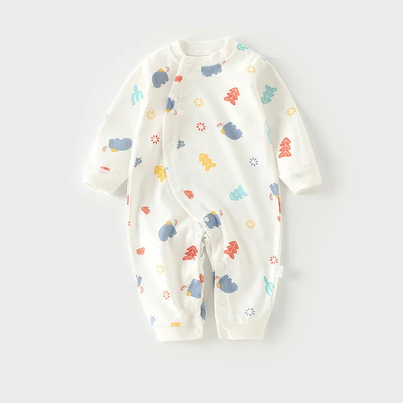 Cotton baby pajamas in cartoon dragon print for a newborn infant.
