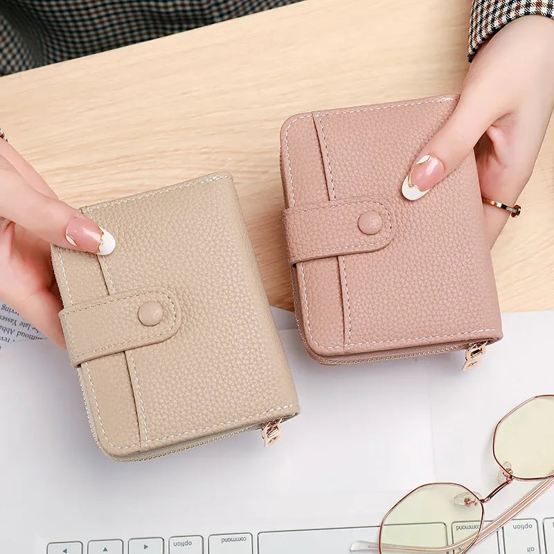 Ladies' short wallet with lychee pattern in PU material showing 2-fold design