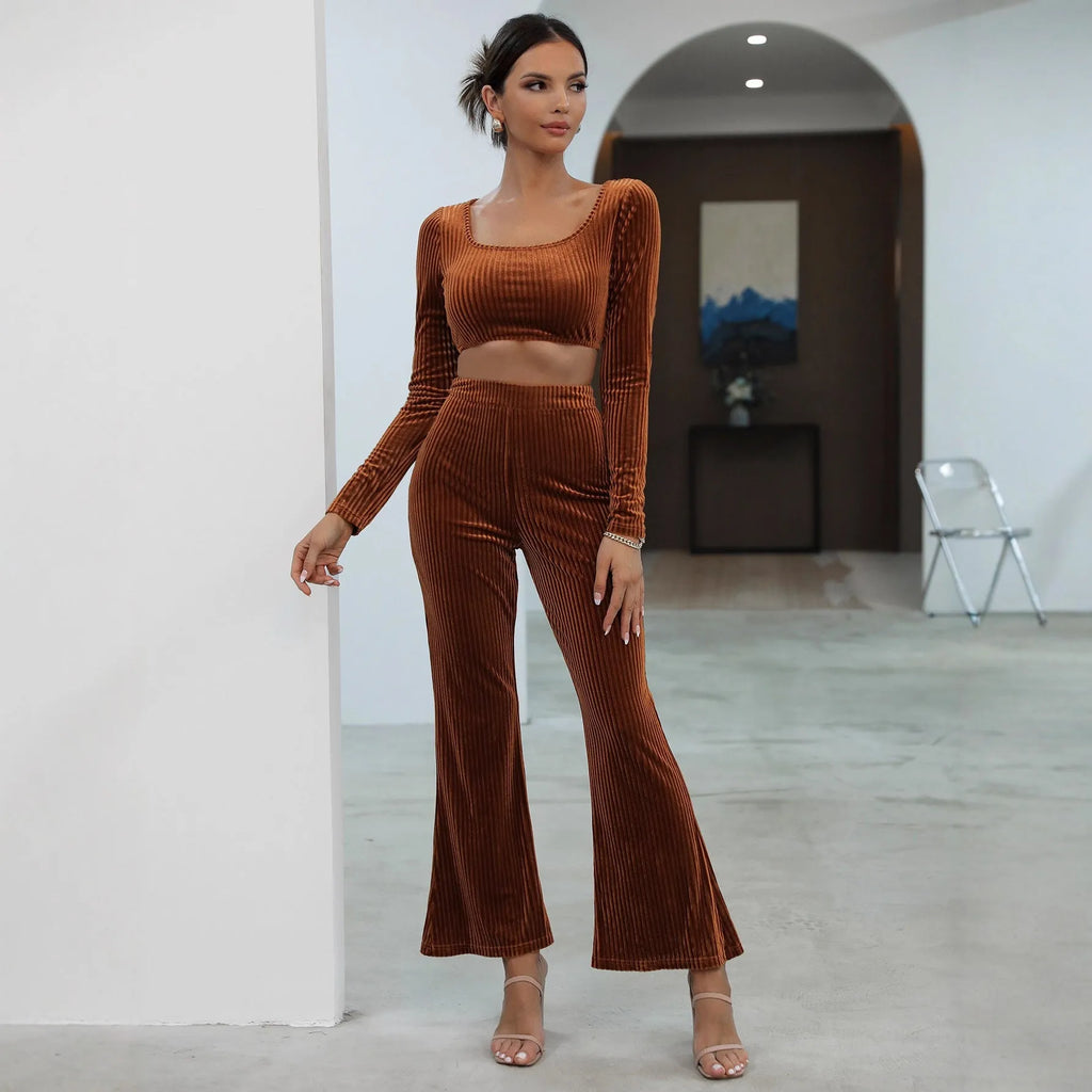 Caramel-coloured women's long sleeve knit sweater and matching trousers laid flat, a two-piece loungewear set.