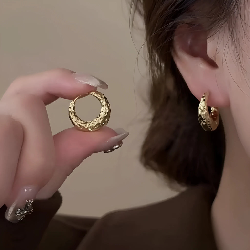 Pair of women's irregular croissant hoop earrings in copper with electroplated silver or gold finish
