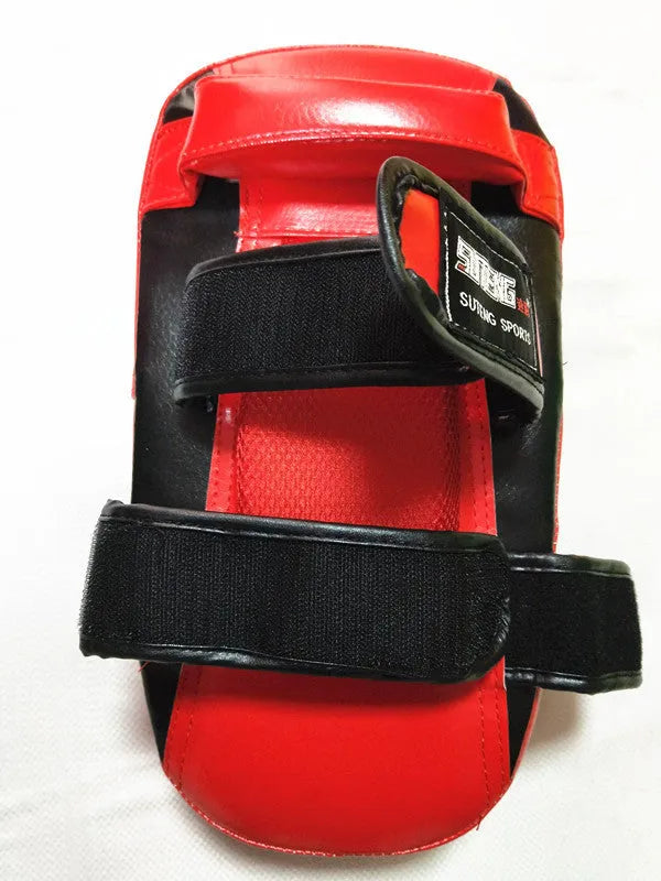 Black and red square hand-held boxing foot target pad with a rear buckle.
