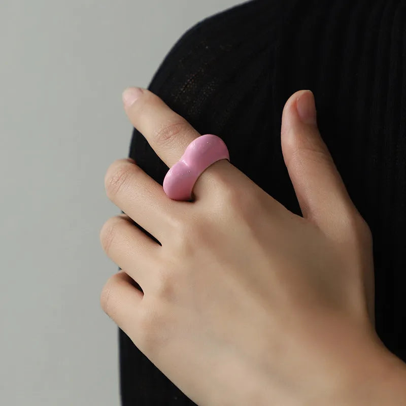 Original three-dimensional enamel heart ring in zinc alloy, shown in black, pink, purple, or red.