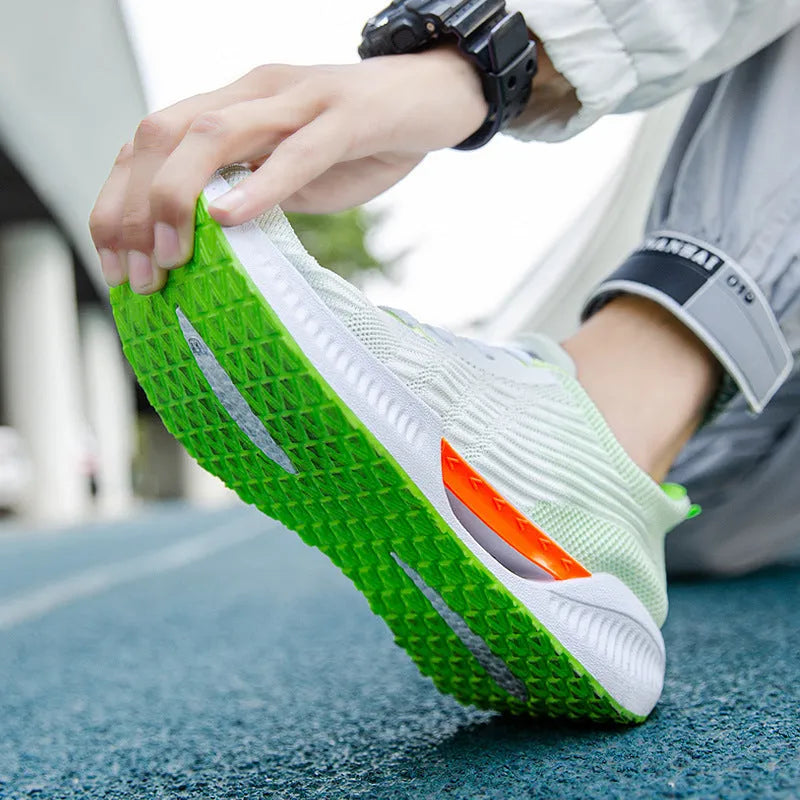 Men's blue casual sports shoes with mesh upper and plastic sole, shown with grey and green colour options.