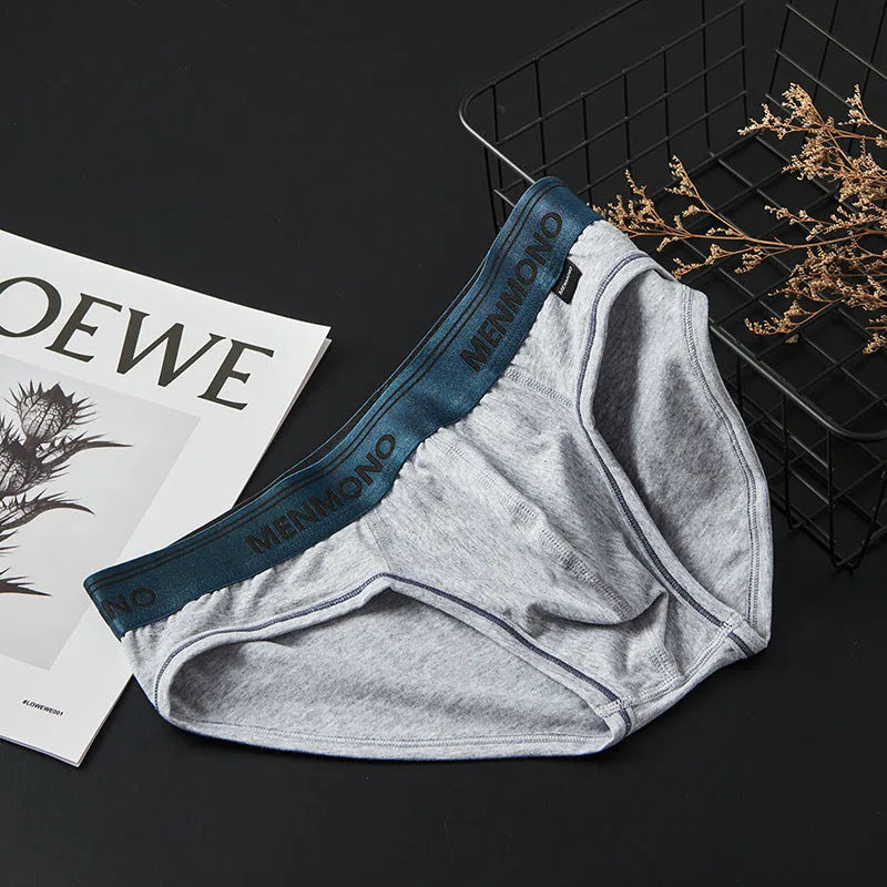 Men's low waist cotton briefs in a solid colour with contrast trim, shown in one of nine available colour combinations.