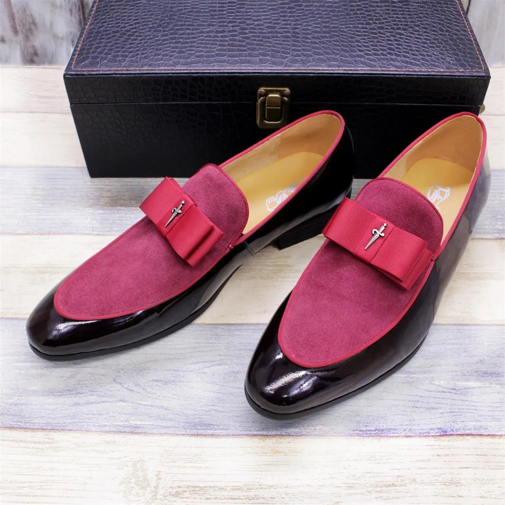 Men's glossy black patent leather low-top shoes with a tassel detail on a white background