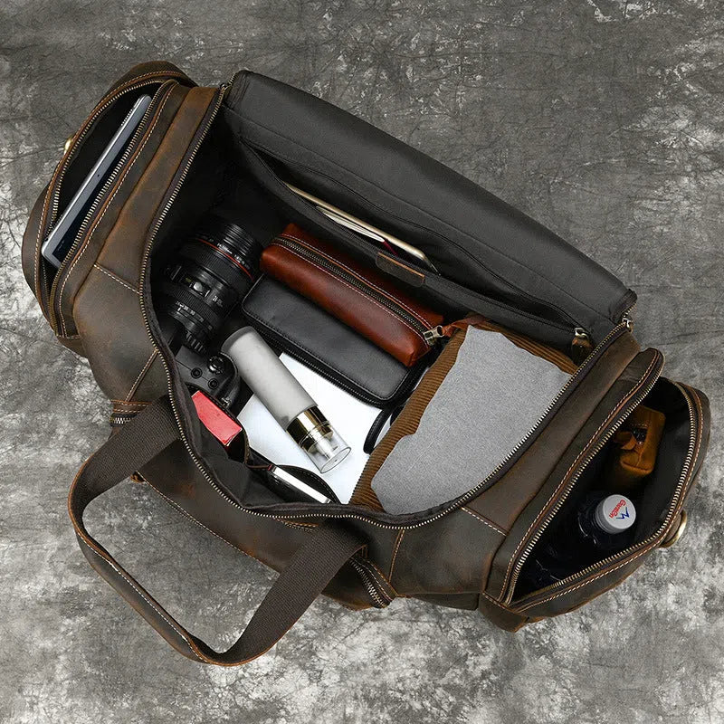 Men's full-grain cowhide leather crossbody bag in dark brown, with stitched seams and shoulder strap, 58cm size