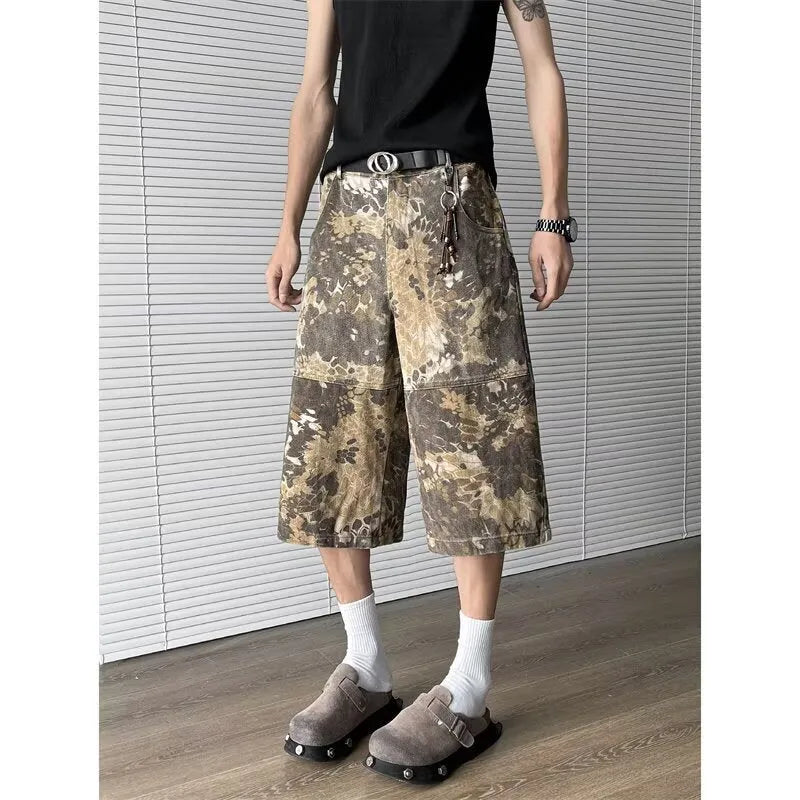 Yellow cotton jeans with a detailed snake pattern and camouflage print, featuring a cropped leg length.