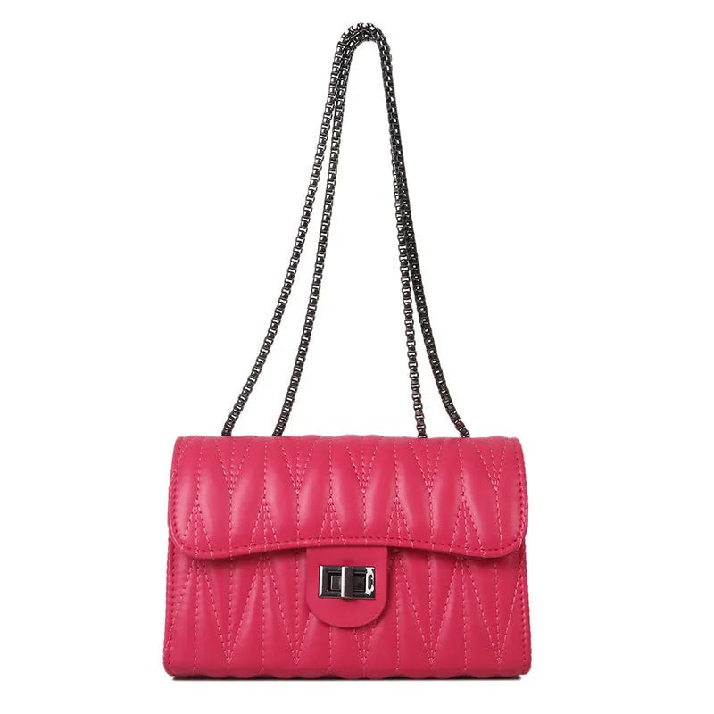 Small beige women's crossbody bag with a retro diamond texture pattern and a soft carry handle.