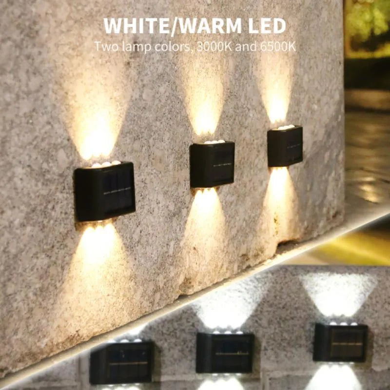 Solar outdoor wall light with up and down glow, black ABS+PC housing, warm white SMD LEDs