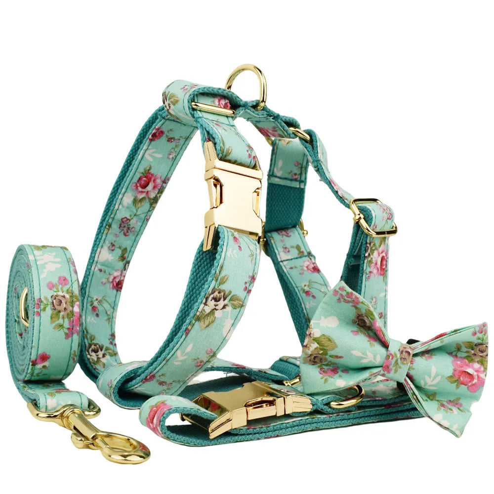 Fabric dog collar set with detachable green rose pattern bow, matching leash and vest