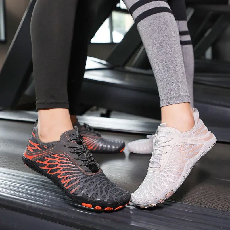 Low-top white outdoor sports shoes with lace-up front and textured rubber sole.