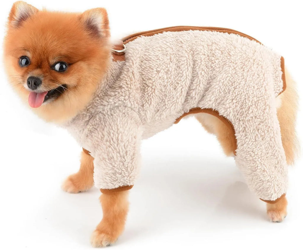 Green fleece dog coat with four-leg jumpsuit design and back zipper closure on a small dog