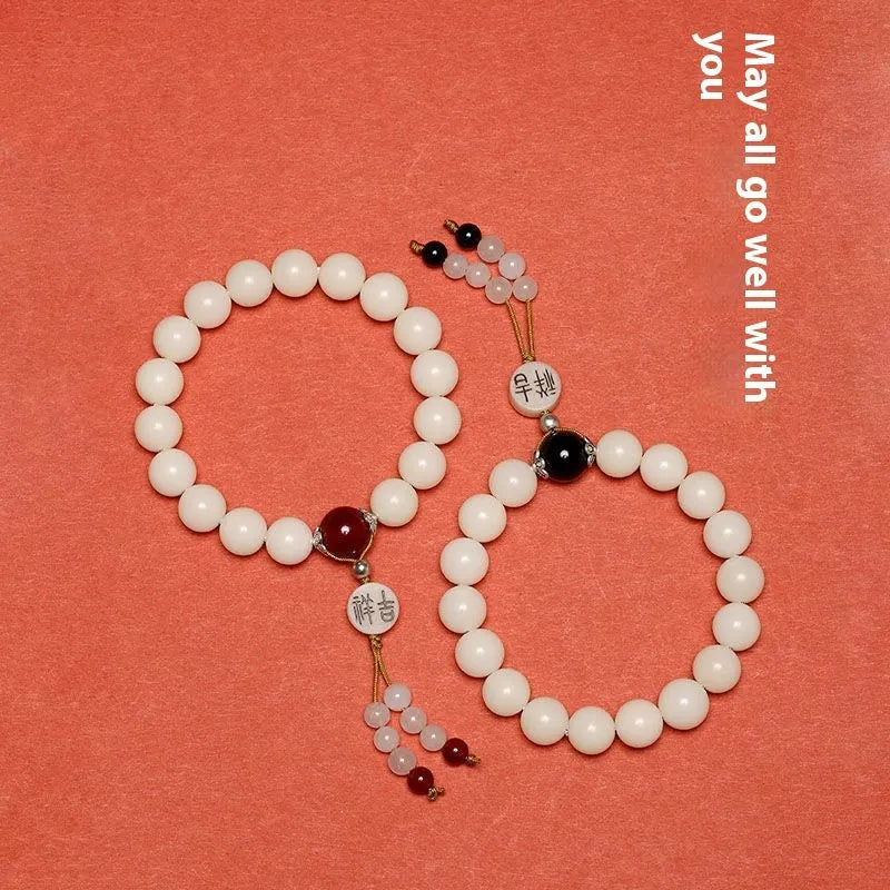 White jade bodhi couple's bracelet with 10mm beads and traditional Ruyi charm
