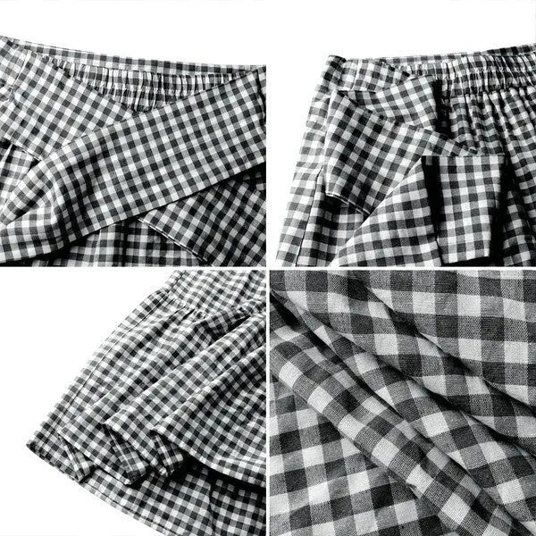 Ruffled hem strappy pleated casual loose skirt in black or blue polyester, sizes S to 3XL.