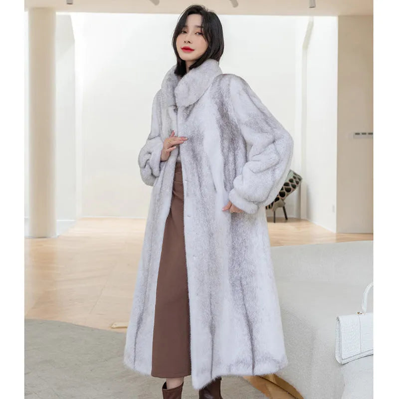 White faux fur coat with a stand-up collar and regular sleeves on a female model.