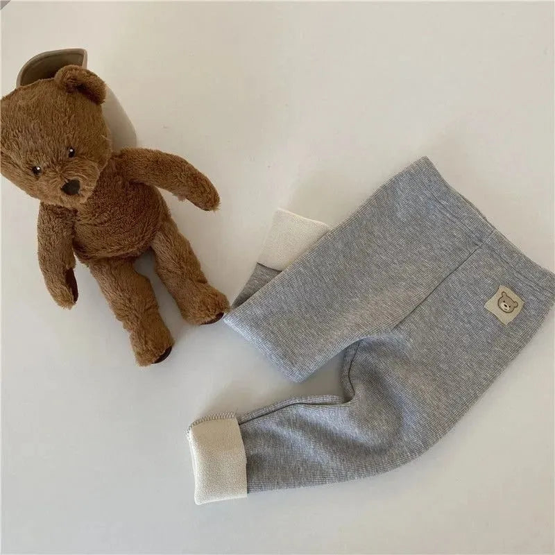 Girls' high-waist fleece-lined leggings in beige, black, brown, and grey colours on a size chart.