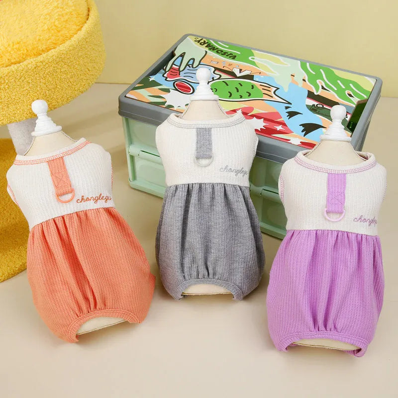 Set of three fashion personalised puppy pyjamas in orange, gray, and purple polyester fabric on white background