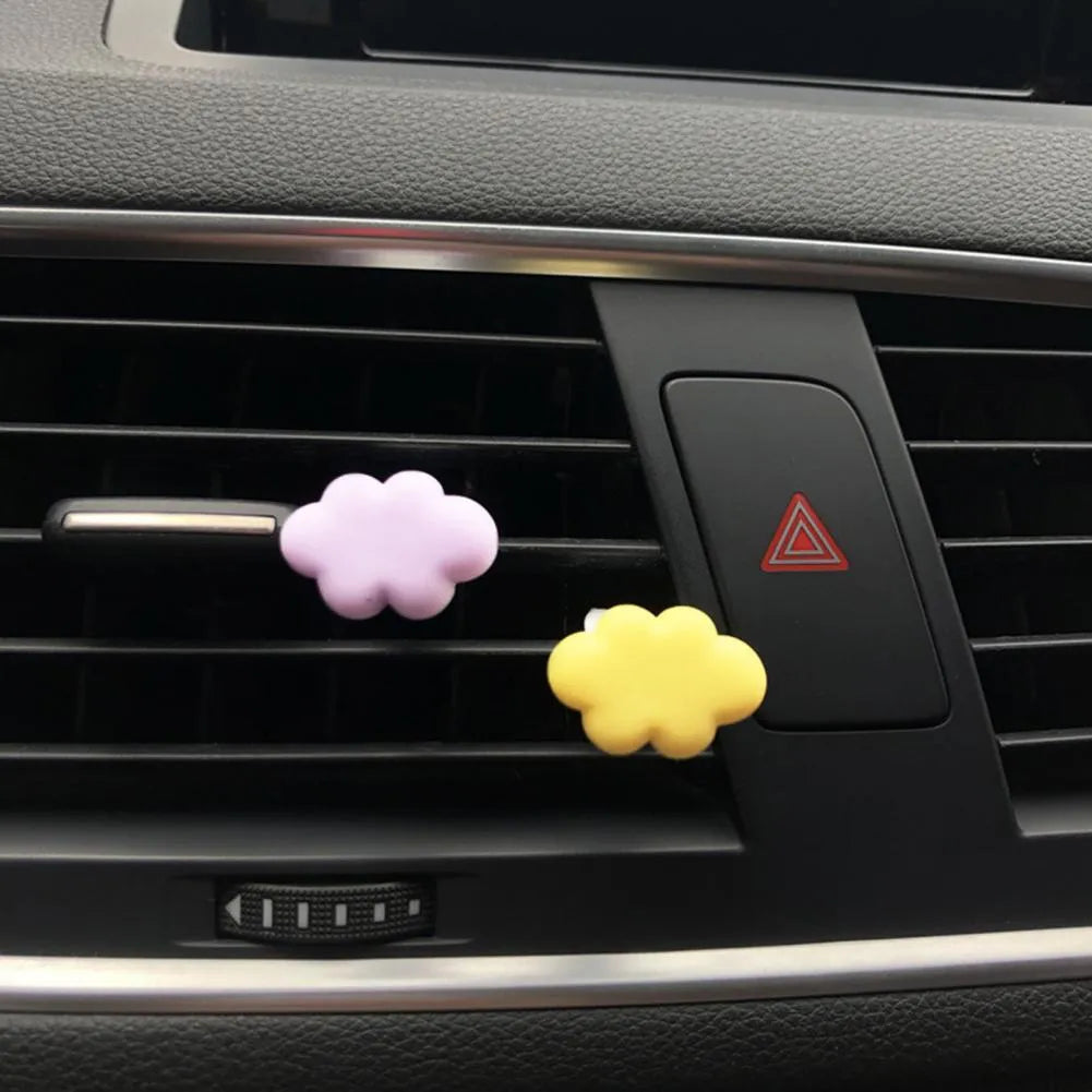 Resin Baiyun cartoon car air freshener clip in six colours on a car vent.