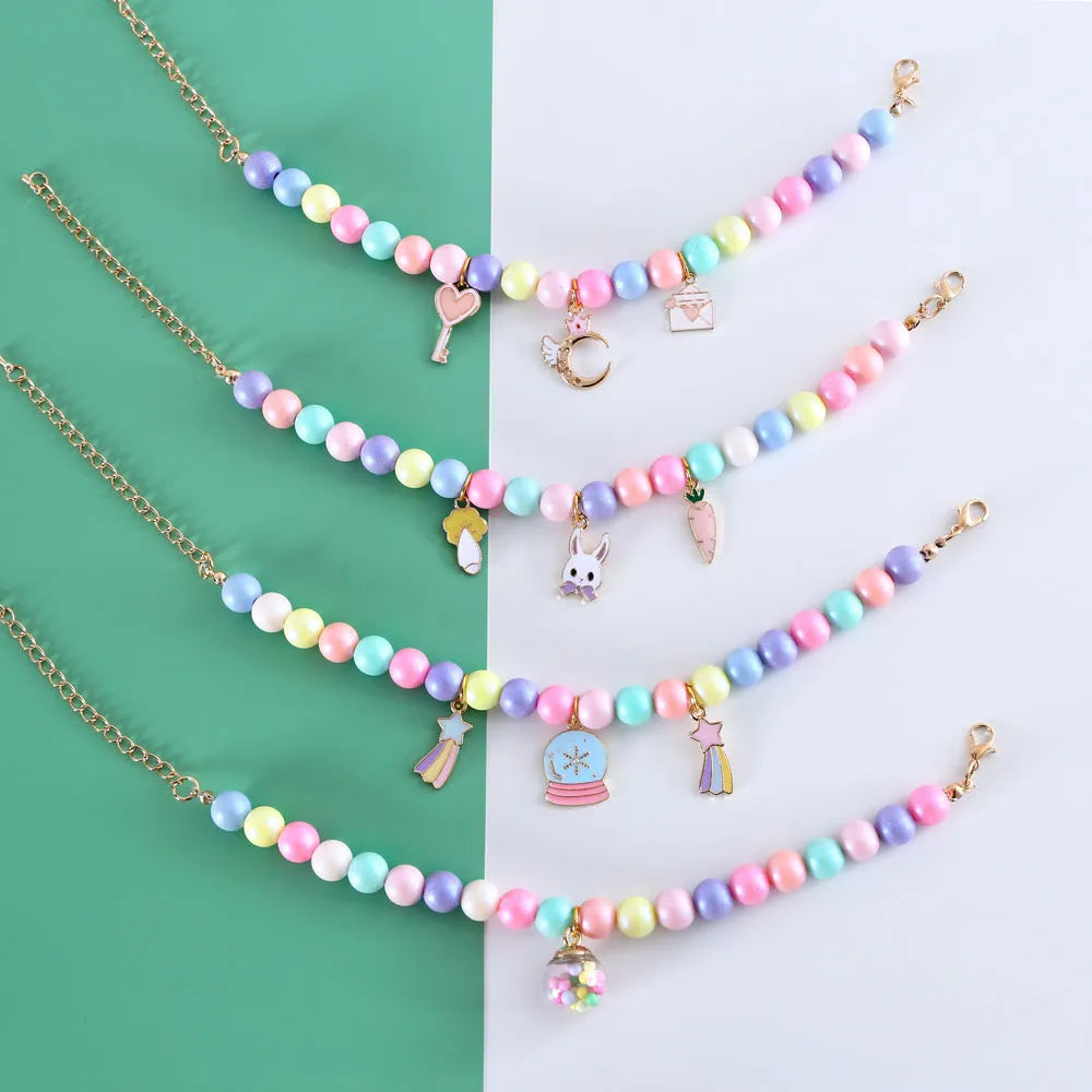 Macaron-coloured dog collar and bracelet set with resin moon, meteor, and rabbit charms in three sizes.