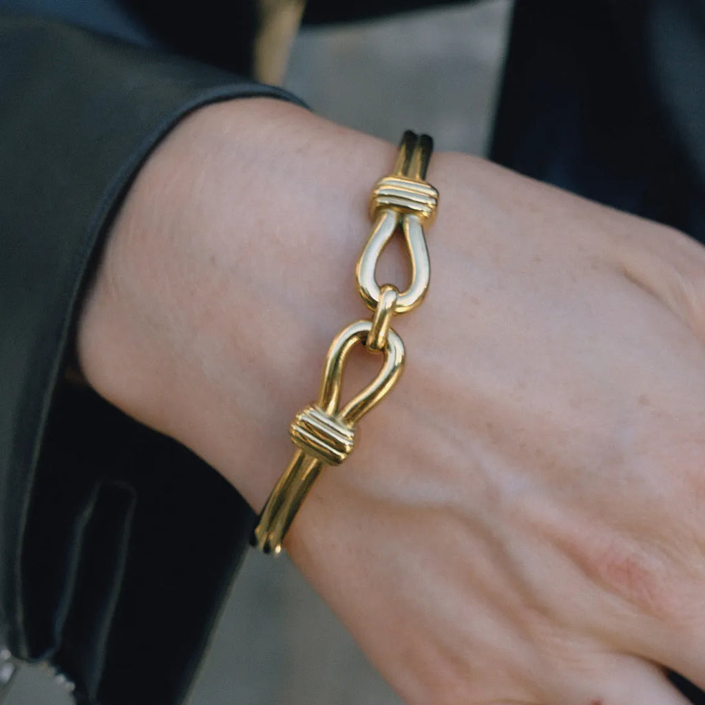 Light luxury stainless steel bracelet with buckle, electroplated finish, connection design, on white background
