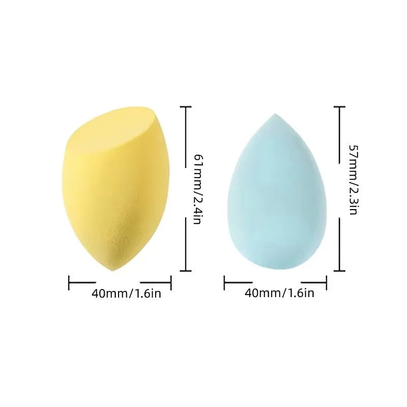 Set of seven coloured makeup sponges in different shapes on a pink background