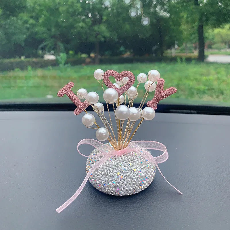 Clay diamond star decoration ornament for a car centre console in a modern colour design.