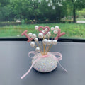Clay diamond star decoration ornament for a car centre console in a modern colour design.