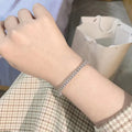Silver plaid bracelet for women with moissanite stone on light background