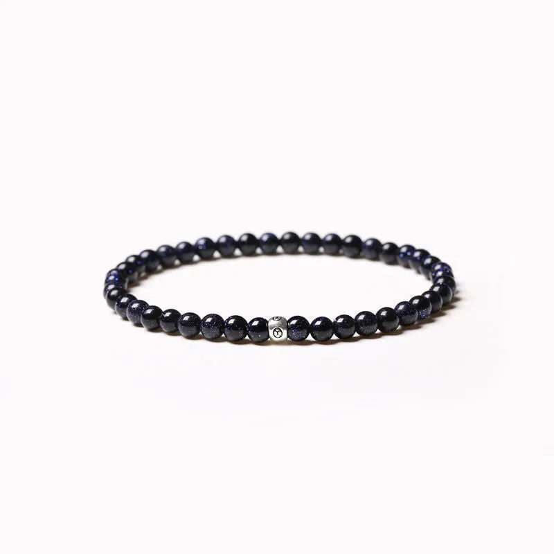 Geometric stone bead bracelet with black agate, blue san, obsidian, and cut surface black agate in chamfered square shapes