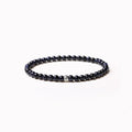Geometric stone bead bracelet with black agate, blue san, obsidian, and cut surface black agate in chamfered square shapes
