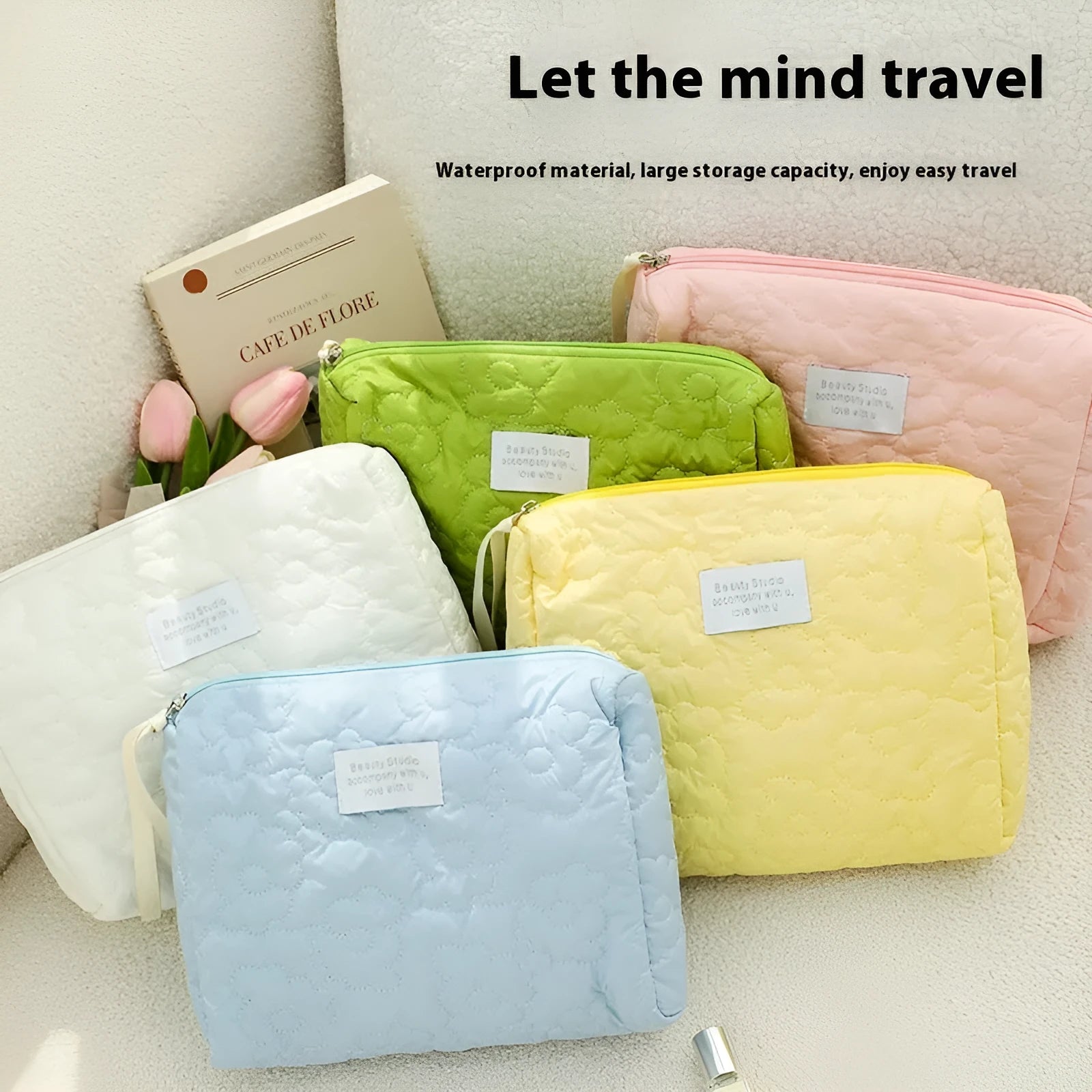 Silk quilted cosmetic bag in candy colours showing quilted texture and storage capacity