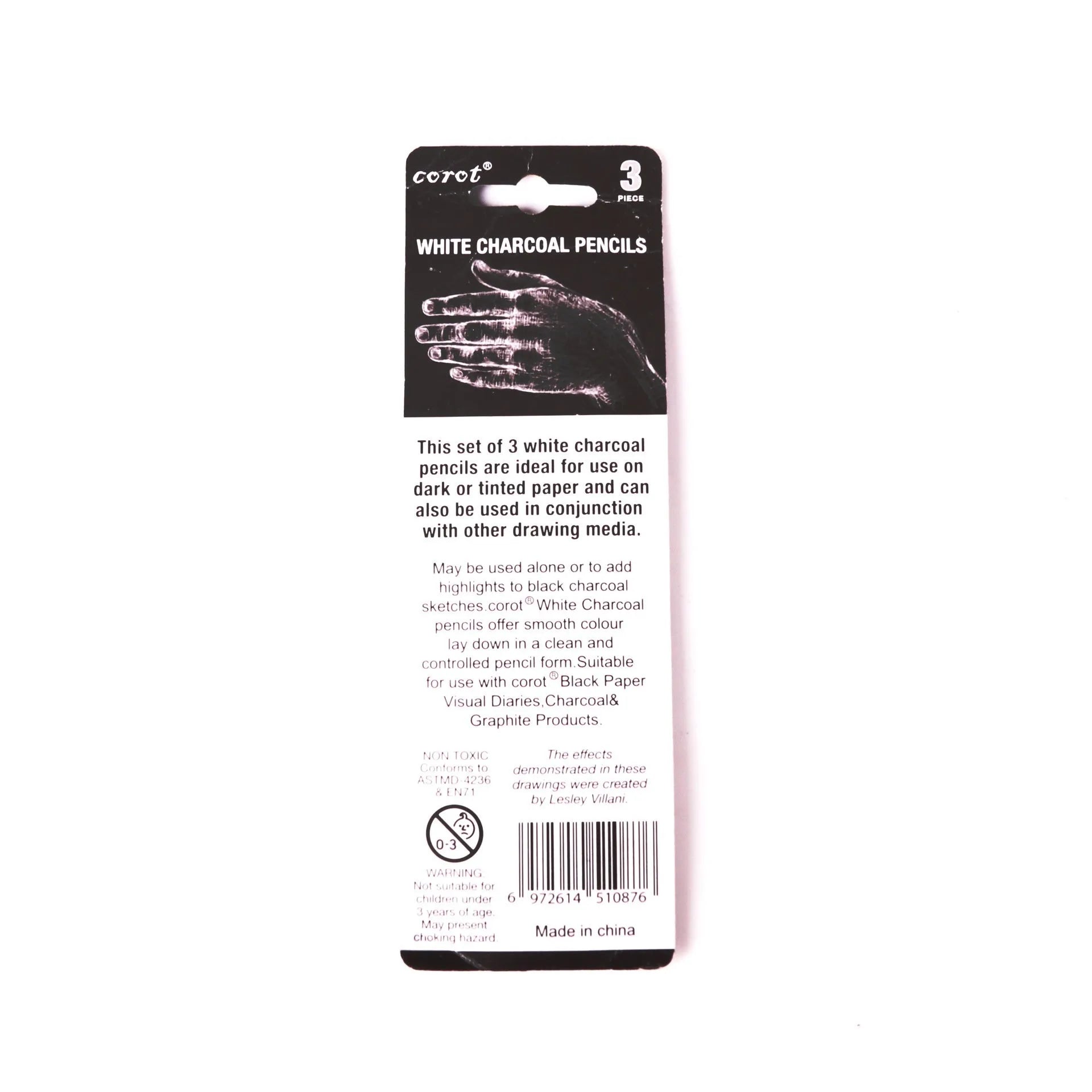 Set of three white charcoal sketching pencils in wooden casings.
