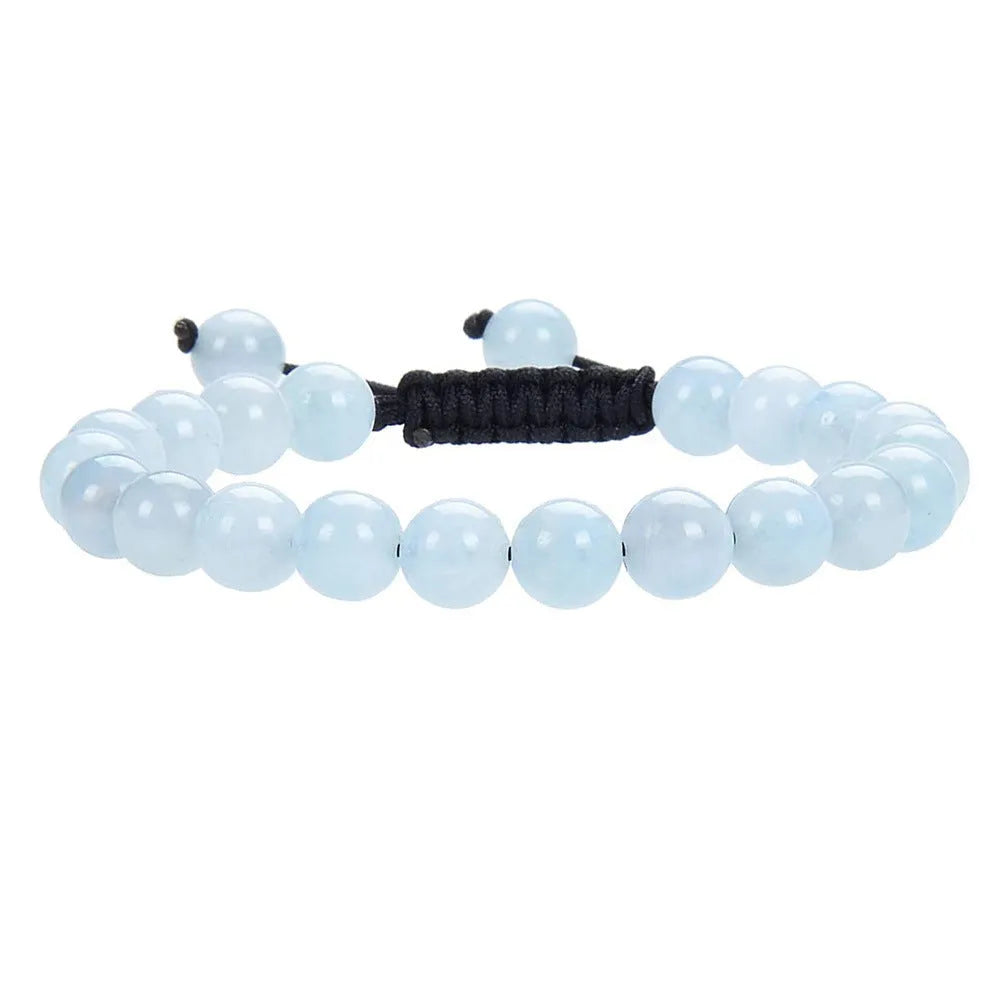 Women's flat knot braided healing bracelet with hand-woven aquamarine beads and geometric patterns