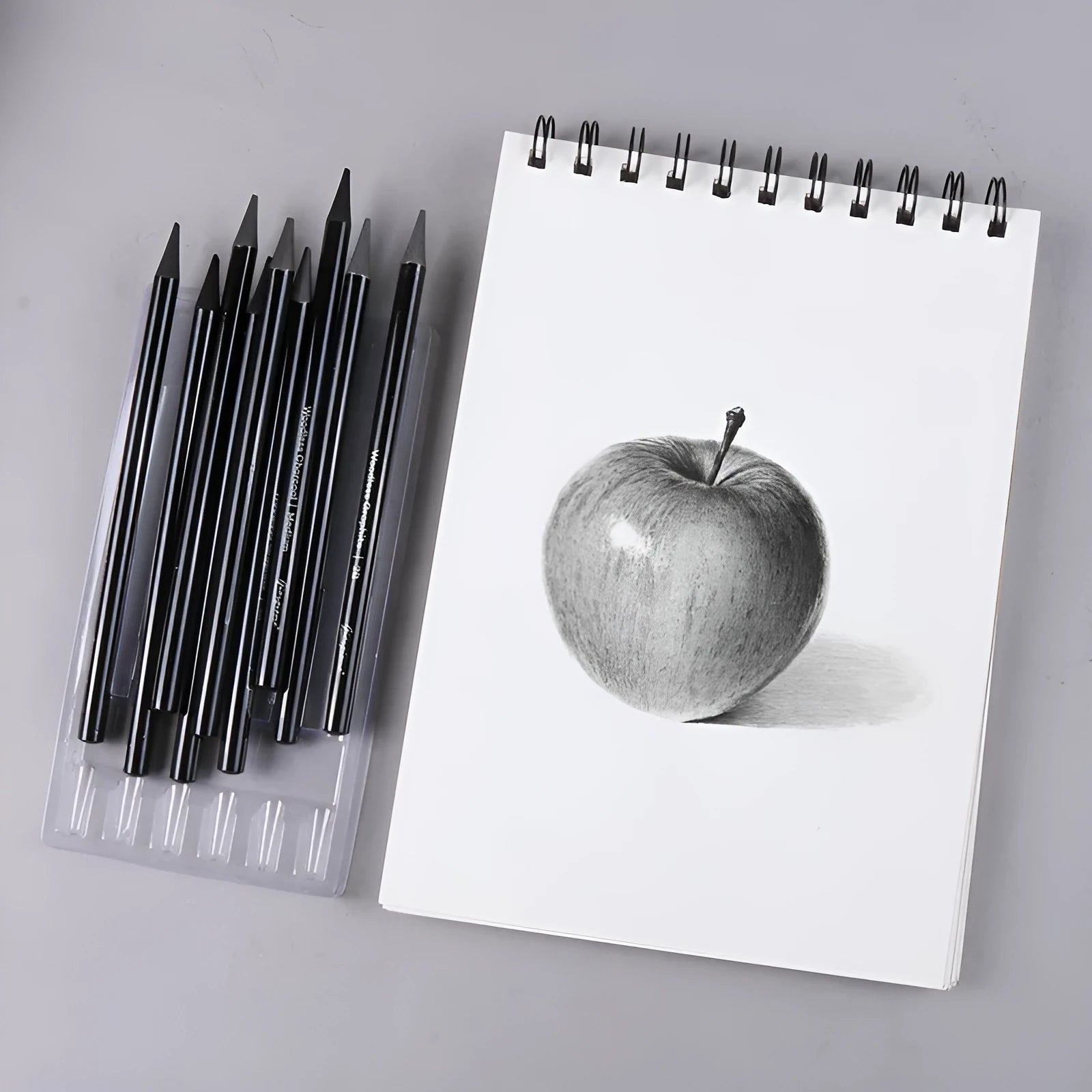 Carbonized Pencil Suit set showing 6 graphite and 3 carbonized pencils on suction card packaging.