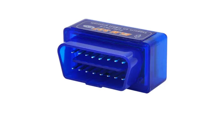 Small black ELM327 Bluetooth OBD2 diagnostic scanner plugged into a car's port.