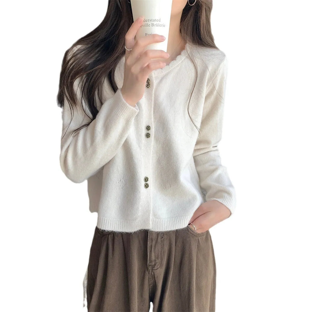 Women's long-sleeved acrylic cardigan coat in light purple, shown with cardigan front open.