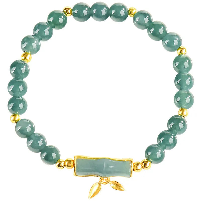 Women's silver bracelet with blue jade beads on a white background.