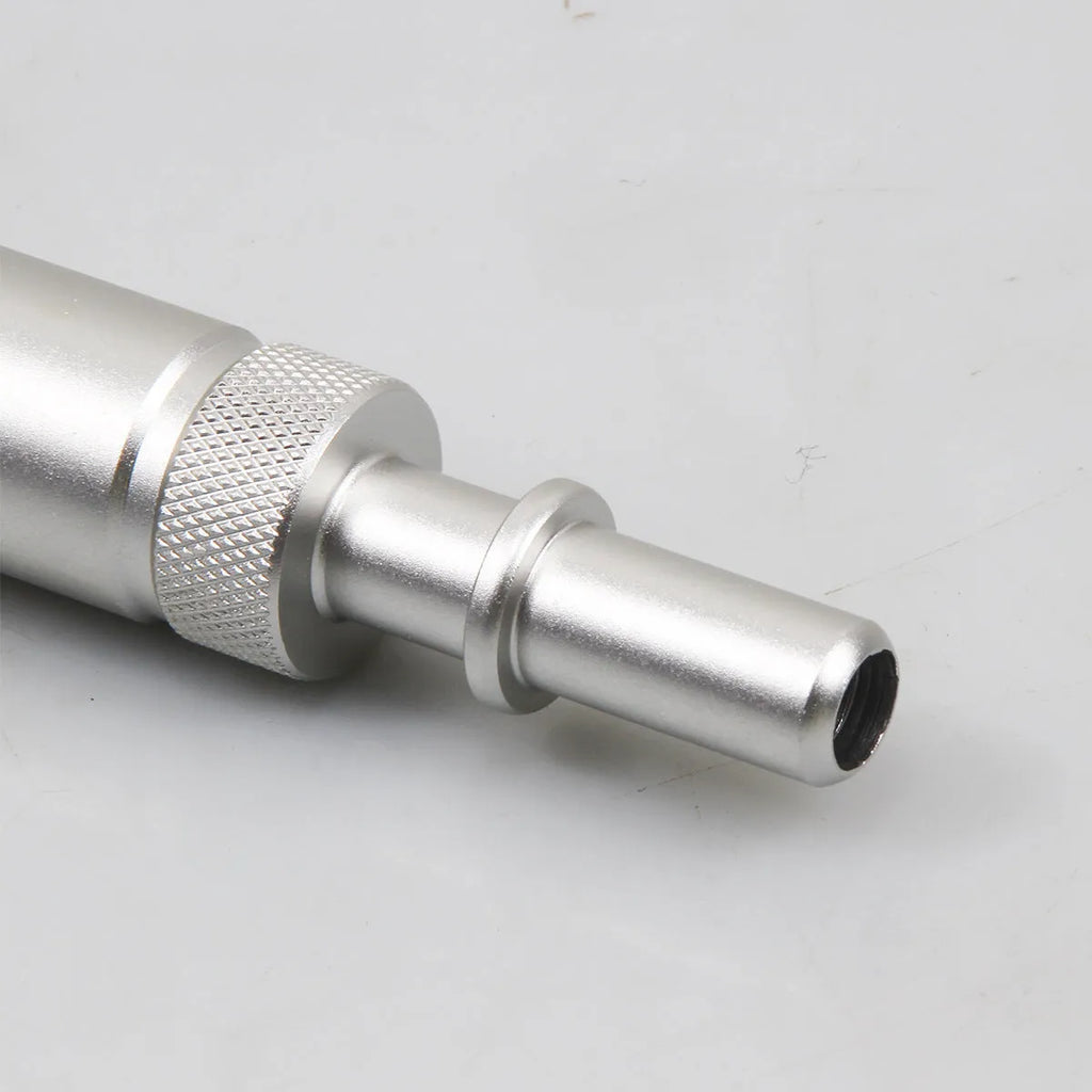 Silver metal VAS6262-9 transmission refueling joint tool on a workshop bench.