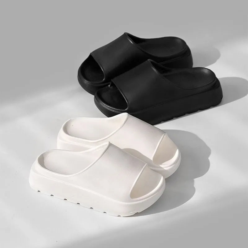 Women's beige fish mouth slippers with a thick 5.5cm EVA sole on a tiled floor.