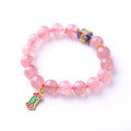 Pink strawberry quartz crystal bracelet with hand-woven Ruyi symbols and text elements