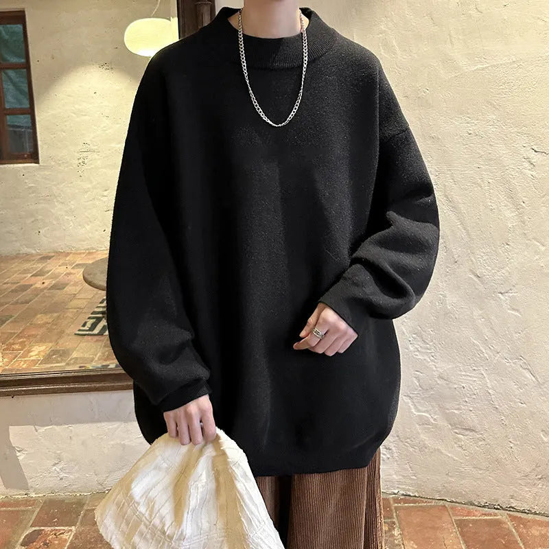 Men's loose fit round neck long sleeve sweater in a solid colour on a hanger.