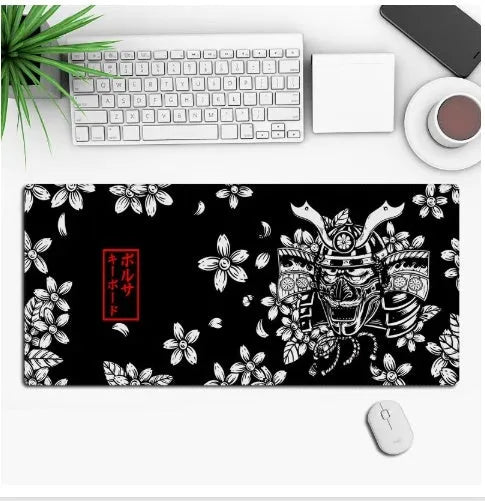 Large black anime-themed gaming mouse pad with non-slip rubber base on a wooden desk.