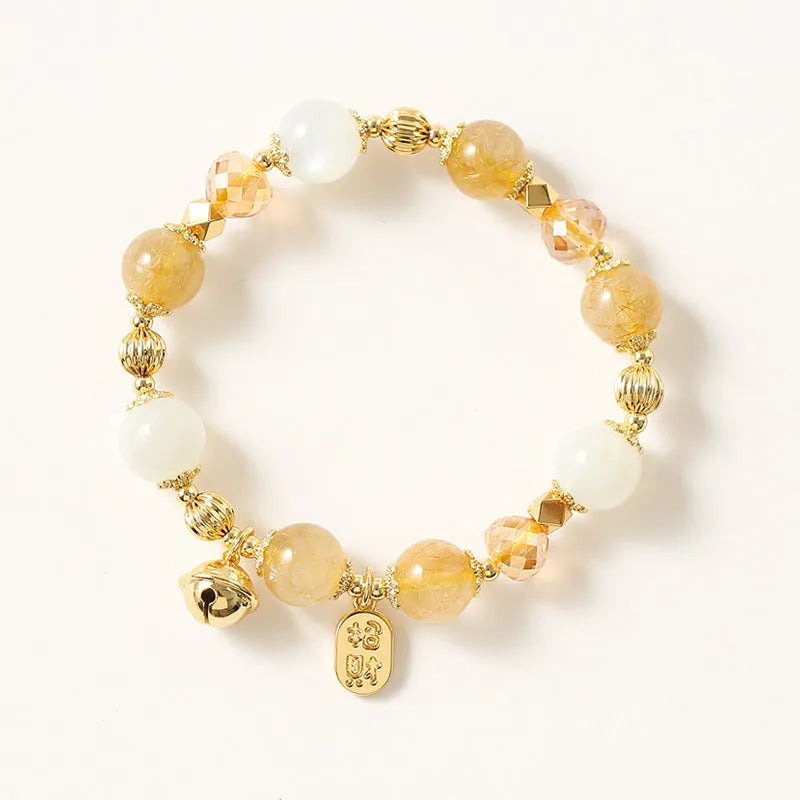 Gold tone rutilated quartz crystal bracelet with electroplated finish and Korean style design